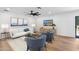 Cozy living room featuring modern furniture, a ceiling fan, and a flatscreen TV for comfortable living at 20 W Pasadena Ave, Phoenix, AZ 85013