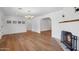 Bright living room showcases light hardwood floors and arched doorways at 20 W Pasadena Ave, Phoenix, AZ 85013