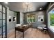Stylish home office featuring grey walls, a dark desk, and a modern chandelier for a sophisticated workspace at 20 W Pasadena Ave, Phoenix, AZ 85013