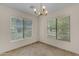Bright dining area featuring tile floors, light fixtures and picturesque windows at 2028 W Alice Ave, Phoenix, AZ 85021
