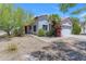 Charming single-story home with desert landscaping, tile roof, and attached garage at 2028 W Alice Ave, Phoenix, AZ 85021