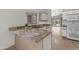This lovely kitchen features granite countertops, recessed lighting, and modern appliances at 2028 W Alice Ave, Phoenix, AZ 85021