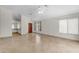Bright and open living room with tile flooring, neutral walls, and views to the kitchen and front entrance at 2028 W Alice Ave, Phoenix, AZ 85021