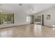 Bright open living area featuring tile floors, sliding glass doors to patio, and vaulted ceilings at 2028 W Alice Ave, Phoenix, AZ 85021