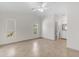 A bright main bedroom with vaulted ceilings, tile floors, and access to the bathroom at 2028 W Alice Ave, Phoenix, AZ 85021