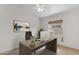 Home office featuring a desk, office chair, and a window with wood-look blinds at 2028 W Alice Ave, Phoenix, AZ 85021