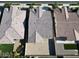 Aerial view of a well-maintained neighborhood, showcasing tile roofs and tidy landscaping at 22876 E Via Del Sol --, Queen Creek, AZ 85142