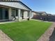 Spacious backyard featuring low-maintenance artificial turf, perfect for outdoor activities and relaxation at 22876 E Via Del Sol --, Queen Creek, AZ 85142