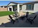Inviting backyard featuring artificial turf, gravel, and outdoor seating around a fire pit, perfect for entertaining at 22876 E Via Del Sol --, Queen Creek, AZ 85142