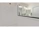 Bathroom features a walk-in shower, large mirror, and white walls, offering a clean and modern design at 22876 E Via Del Sol --, Queen Creek, AZ 85142