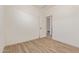 A bright and open bedroom with light wood floors and an open doorway at 22876 E Via Del Sol --, Queen Creek, AZ 85142