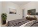 Comfortable bedroom featuring neutral tones, recessed lighting, and a mounted television at 22876 E Via Del Sol --, Queen Creek, AZ 85142