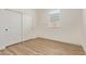 Bright bedroom with wood floors, a window, and a double closet that enhances the room's features at 22876 E Via Del Sol --, Queen Creek, AZ 85142
