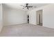 Neutral bedroom features carpet, ceiling fan and lots of open space at 22876 E Via Del Sol --, Queen Creek, AZ 85142