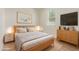 Bright bedroom featuring a cozy bed, modern decor, and natural light from the window at 22876 E Via Del Sol --, Queen Creek, AZ 85142
