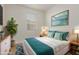 Stylishly decorated bedroom with a comfortable bed, matching nightstands, and bright artwork at 22876 E Via Del Sol --, Queen Creek, AZ 85142