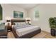 Comfortable bedroom with a padded headboard and a serene ambiance, featuring a modern design at 22876 E Via Del Sol --, Queen Creek, AZ 85142