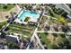 Aerial view showcasing the community pool and recreational areas with lush landscaping and walking paths at 22876 E Via Del Sol --, Queen Creek, AZ 85142
