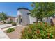 Charming home exterior showcases a turret entryway with red tile details and lush landscaping at 22876 E Via Del Sol --, Queen Creek, AZ 85142