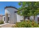 Charming home featuring a unique turret entry, beautiful flowers, and well-maintained landscaping at 22876 E Via Del Sol --, Queen Creek, AZ 85142