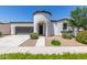 Charming home featuring a unique turret entry, manicured landscaping, and a two-car garage at 22876 E Via Del Sol --, Queen Creek, AZ 85142
