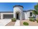 Charming home featuring a unique turret entry, manicured landscaping, and a two-car garage at 22876 E Via Del Sol --, Queen Creek, AZ 85142