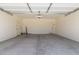 Spacious garage with concrete flooring, garage door opener, and interior access door at 22876 E Via Del Sol --, Queen Creek, AZ 85142