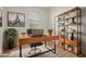 Comfortable home office with stylish wooden desk and shelving, perfect for remote work at 22876 E Via Del Sol --, Queen Creek, AZ 85142