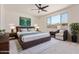 Inviting primary bedroom with ceiling fan, large window, and stylish decor at 22876 E Via Del Sol --, Queen Creek, AZ 85142