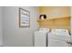 Laundry room with a full-sized washer and dryer at 24063 W Cocopah St, Buckeye, AZ 85326