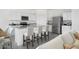 Modern kitchen with white cabinetry, stainless steel appliances, and granite countertops at 24245 W Hidalgo Ave, Buckeye, AZ 85326