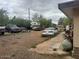 Open backyard with ample parking and various vehicles at 25 W Illini St, Phoenix, AZ 85041