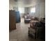 Basement space featuring tile floors, windows, and ample storage at 25 W Illini St, Phoenix, AZ 85041