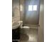Simple bathroom featuring a shower-tub combo and a single-sink vanity at 25 W Illini St, Phoenix, AZ 85041