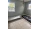 Bedroom with tiled flooring and two bright windows for natural light at 25 W Illini St, Phoenix, AZ 85041