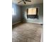 Clean bedroom with tile flooring and a ceiling fan at 25 W Illini St, Phoenix, AZ 85041