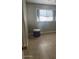Bedroom with tile floors and a window at 25 W Illini St, Phoenix, AZ 85041