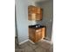 Corner of the kitchen featuring tile floors, wooden cabinets, and black counter tops at 25 W Illini St, Phoenix, AZ 85041