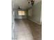 The living room has a ceiling fan, tile floors, and natural light from the window at 25 W Illini St, Phoenix, AZ 85041