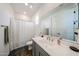 Bathroom with a framed mirror, single sink, and shower/tub combo at 25051 N 140Th Dr, Surprise, AZ 85387