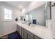 Double sink bathroom vanity with framed mirror in modern home at 25051 N 140Th Dr, Surprise, AZ 85387