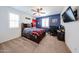 Comfortable bedroom with a ceiling fan, study desk, and natural light streaming in at 25051 N 140Th Dr, Surprise, AZ 85387