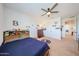 A sports themed bedroom featuring a ceiling fan, closet, and a twin size bed at 25051 N 140Th Dr, Surprise, AZ 85387
