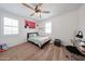 Comfortable bedroom with neutral carpet, fan, and cozy decor at 25051 N 140Th Dr, Surprise, AZ 85387