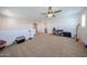 Expansive bonus room with neutral carpet, and plenty of space for multiple activities at 25051 N 140Th Dr, Surprise, AZ 85387