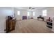 Versatile bonus room featuring neutral carpet, ample space for play, and natural light at 25051 N 140Th Dr, Surprise, AZ 85387