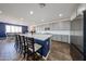 Modern kitchen featuring grey cabinets, a large island, and stainless steel appliances at 25051 N 140Th Dr, Surprise, AZ 85387