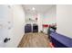 Functional laundry room with wood-look tile floor and modern washer and dryer at 25051 N 140Th Dr, Surprise, AZ 85387