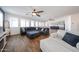 Inviting living room with wood look floors, comfortable seating, and seamless kitchen access at 25051 N 140Th Dr, Surprise, AZ 85387