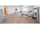 A spacious main bedroom featuring a ceiling fan, carpeted floors, a TV and a desk area at 25051 N 140Th Dr, Surprise, AZ 85387